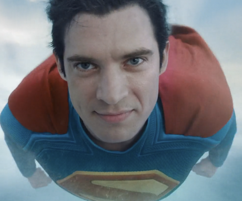 Superman as played by David Corenswet flying with his face towards the camera